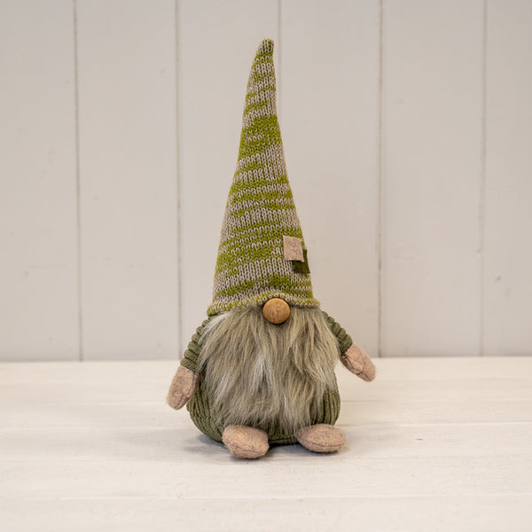 Large green fabric gonk with striped pointed hat and long beard