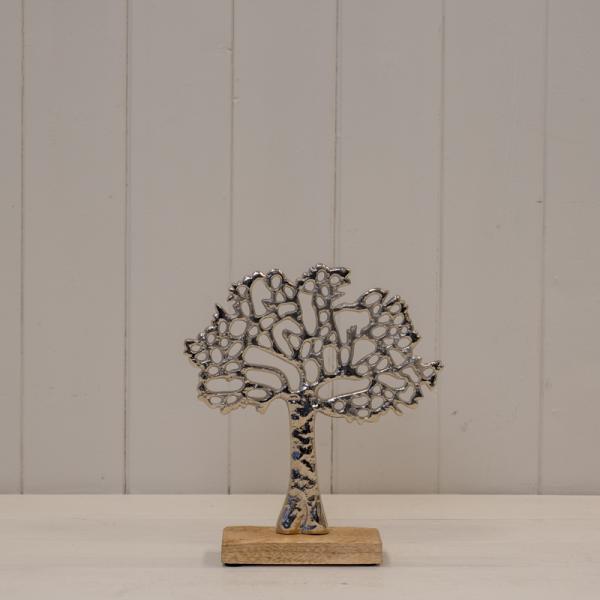 Silver-coloured Tree of Life ornament on a rectangular wooden base