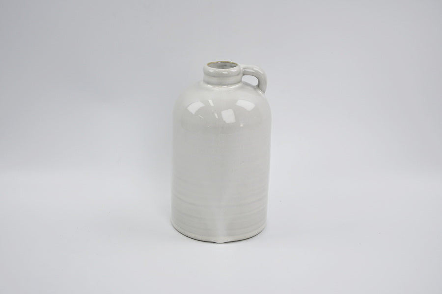 Short white jug-shaped vase with a small handle