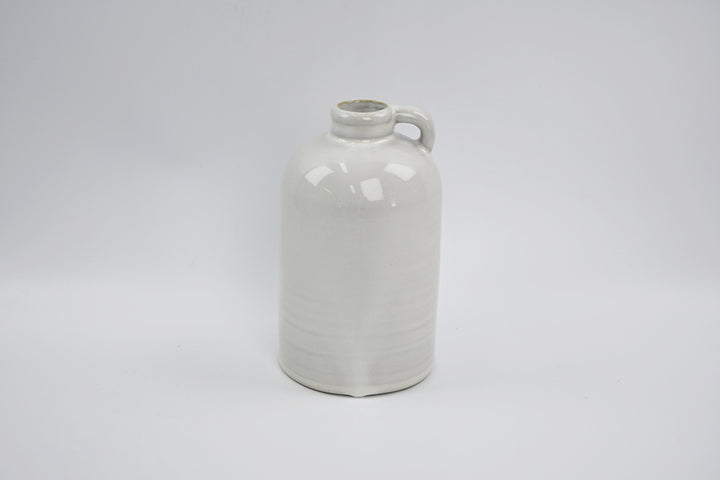 Short white jug-shaped vase with a small handle