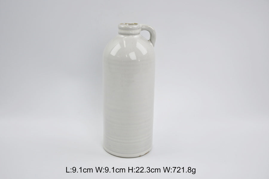 Tall white jug-shaped vase with printed measurements