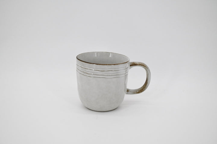 Pale grey stoneware mug with horizontal ridges near the rim, front view
