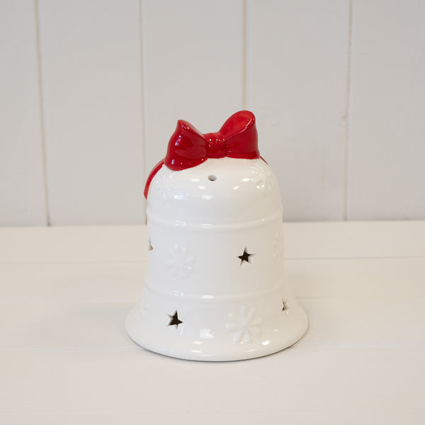 White Christmas bell with a red bow and star cut-outs