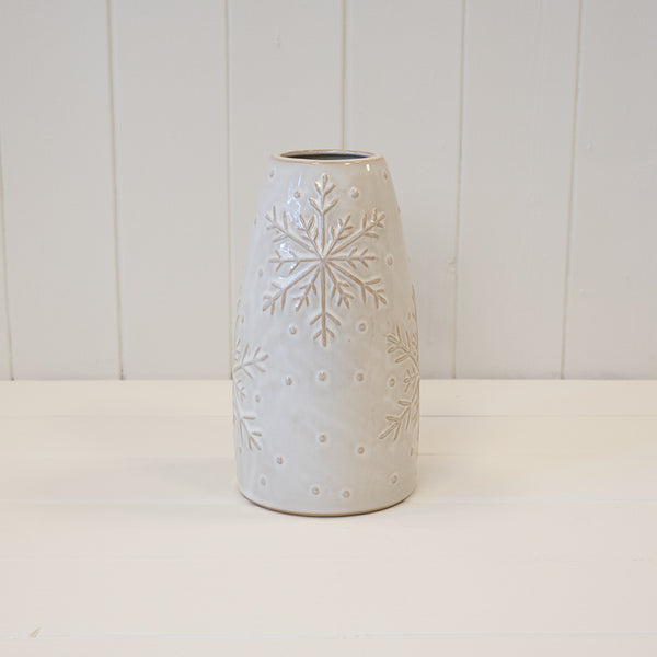 Tall white vase with raised snowflake detail