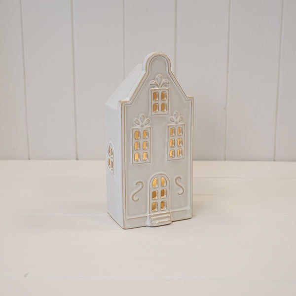Large white LED Christmas townhouse with windows illuminated