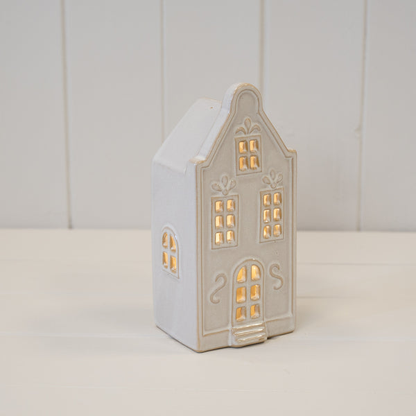 Medium white LED Christmas townhouse with windows illuminated