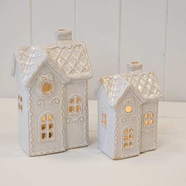 Two decorated LED Christmas townhouses pictured together