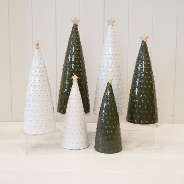 White and green bobbin Christmas trees in several sizes displayed together
