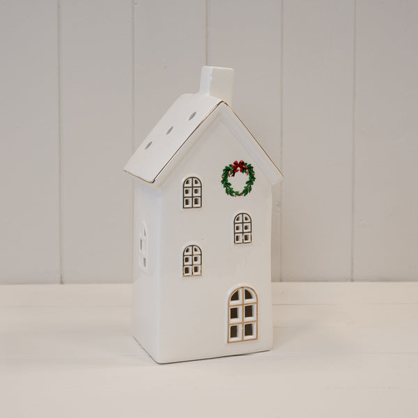 Large white LED house with wreath, shown unlit