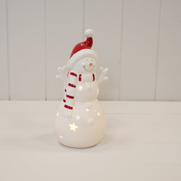 Large LED snowman with red hat and scarf, shown illuminated