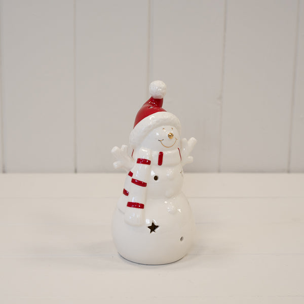 Medium white LED snowman with a red hat and striped scarf