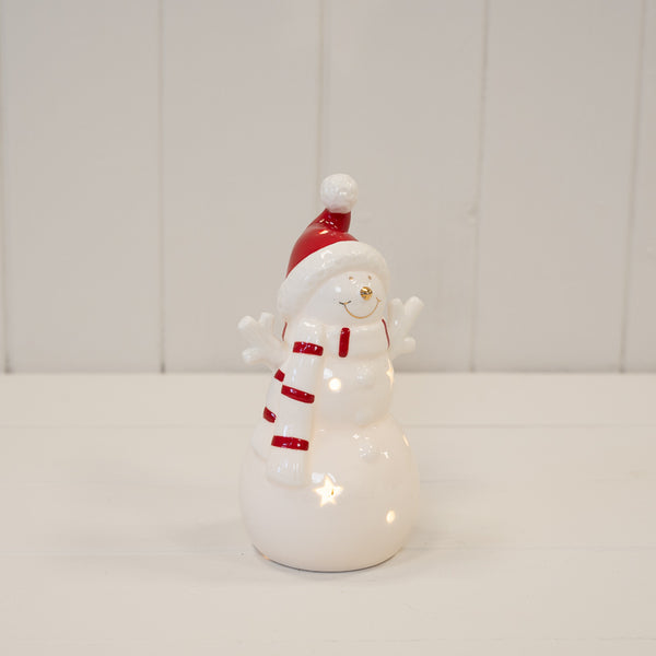 Medium LED snowman with red hat and scarf, shown illuminated