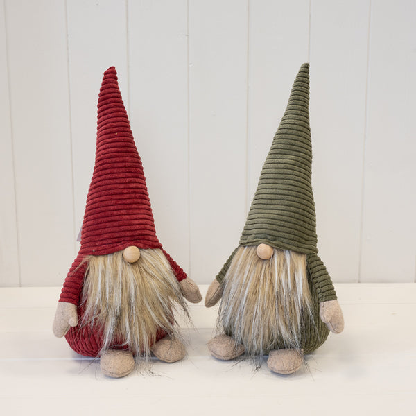 Red and green fabric Santa gonks displayed together