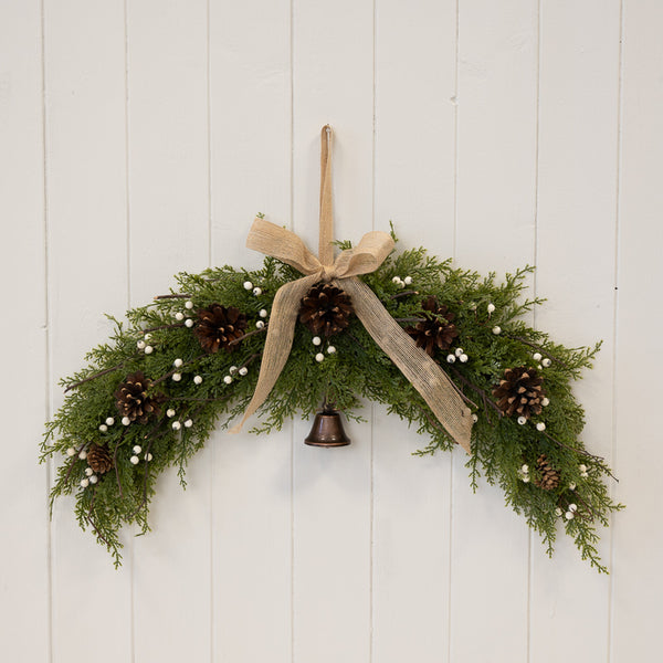 Arc Swag with White Berries, Pinecones with Bells and Bow Detail