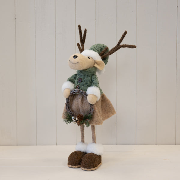 Standing female felt elk ornament in sage and neutral winter clothing