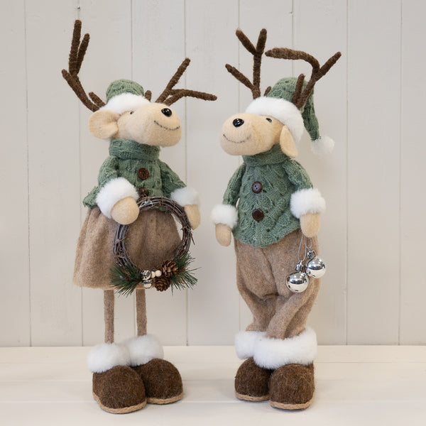Male and female felt elk ornaments displayed together