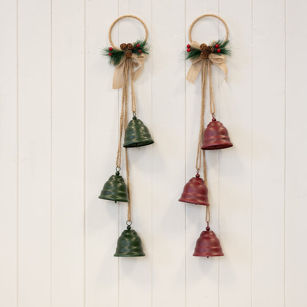 Red and green hanging bell decorations displayed side by side
