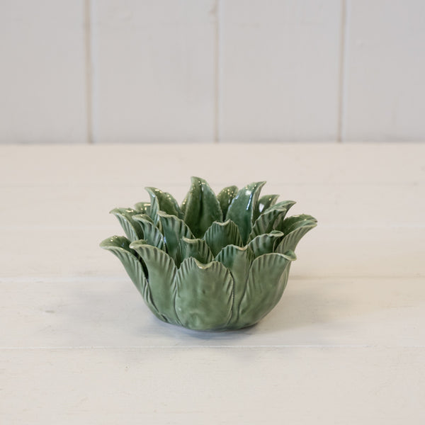 Green flower-shaped ornament with layered petals